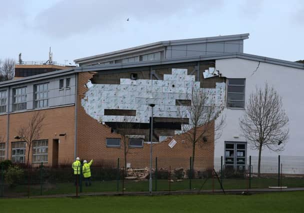 A collapsed wall at Oxgangs Primary School in Edinburgh prompted inspections across the country - but a year later, not all have been completed.