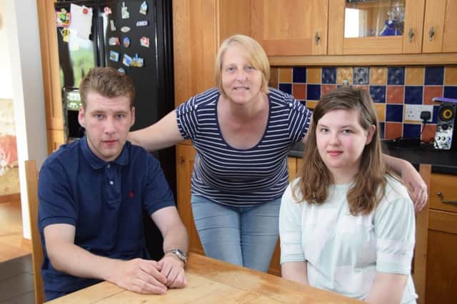 Mary Moffat with son Stephen and daughter Rachael, who both received heart transplants when they were younger. Picture: Contributed