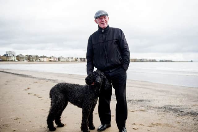 Lisbon Lion Bobby Lennox on the beach at his beloved Saltcoats with his poodle Yanna. Picture: John Devlin