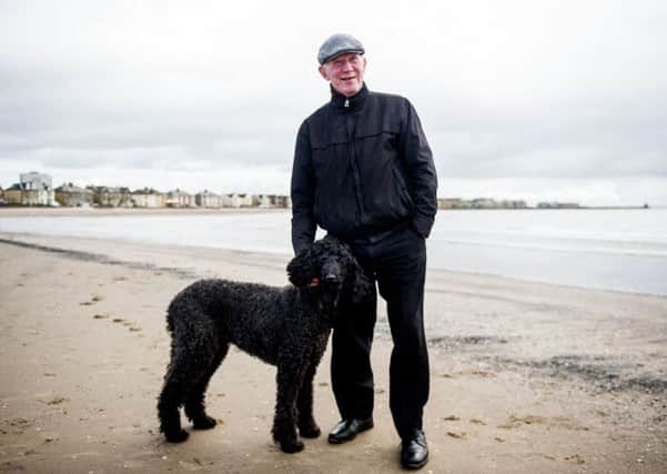Lisbon Lion Bobby Lennox on the beach at his beloved Saltcoats with his poodle Yanna. Picture: John Devlin