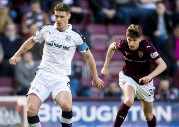 Dundee's Darren O'Dea, in action against Hearts, says there is no need to panic. Picture: Bill Murray/SNS