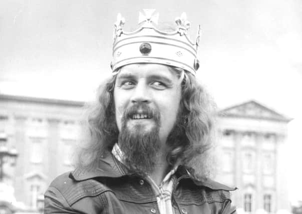 Billy Connolly outside Buckingham Palace in 1974. He shot to fame with jokes about jobbies and the Crucifixion, which had previously been considered no-go areas. Picture: Getty Images