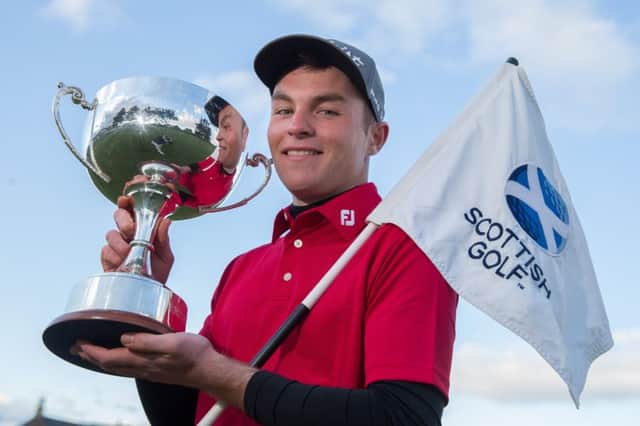 John Paterson poses with the trophy after winning the Scottish Boys Open Stroke-Play Championship. Picture: Kenny Smith