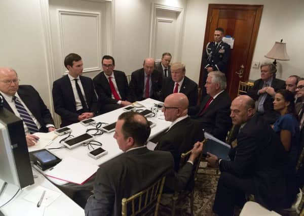Trump receives a briefing on the Syria military strike from his National Security team, including a video teleconference, in a secured location at Mar-a-Lago in Palm Beach, Florida. Picture: White House via AP