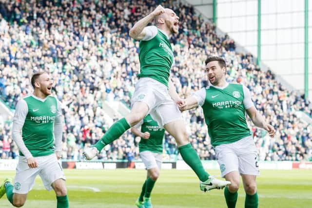 David Gray celebrates Hibs' third goal. Pic: SNS/Roddy Scott