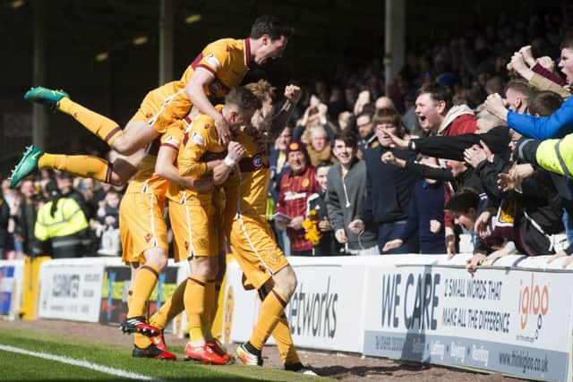 Motherwell players celebrate Chris Cadden's goal in the big clash with Inverness down the bottom of the league. Pic: SNS/Bill Murray