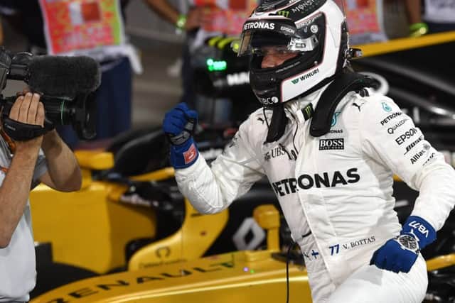 Mercedes' Finnish driver Valtteri Bottas celebrates after taking the pole position at the end of the qualifying for the Bahrain Grand Prix. Picture: Getty Images
