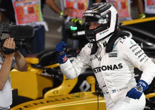 Mercedes' Finnish driver Valtteri Bottas celebrates after taking the pole position at the end of the qualifying for the Bahrain Grand Prix. Picture: Getty Images