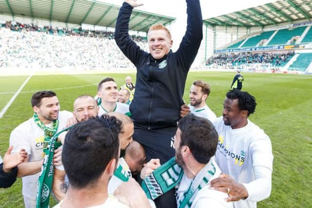 Hibernian manager Neil Lennon celebrates leading his team into the Championship. Pic: SNS/Roddy Scott