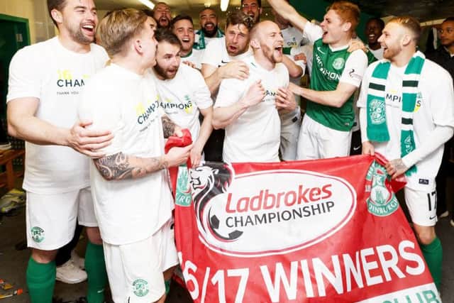 Hibs players celebrate their title win. Pic: SNS/Roddy Scott