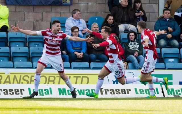 Michael Devlin celebrates Hamilton's second goal. Pic: SNS/Ross Parker