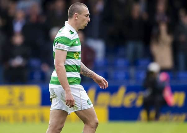 Celtic's Scott Brown leaves the field after being shown a red card. Picture: SNS.