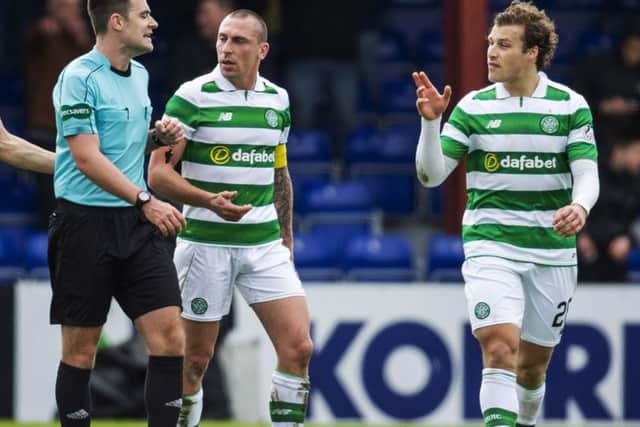 Celtic's Scott Brown appeals to the referee after Ross County are awarded a penalty. Picture: SNS