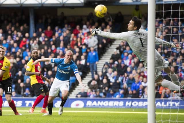 Rangers striker Kenny Miller opens the scoring as his header flies past Tomas Cerny in the Partick goal. Picture: Rob Casey/SNS