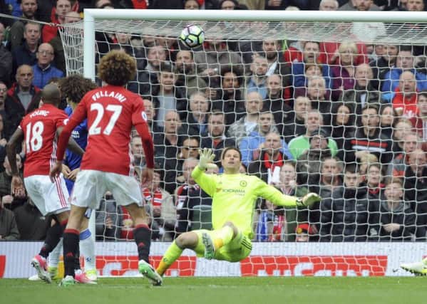Chelsea goalkeeper Asmir Begovic is helpless as a deflected shot by Ander Herrera, not in picture, loops over him for Uniteds second. Picture: AP