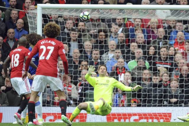 Chelsea goalkeeper Asmir Begovic is helpless as a deflected shot by Ander Herrera, not in picture, loops over him for Uniteds second. Picture: AP