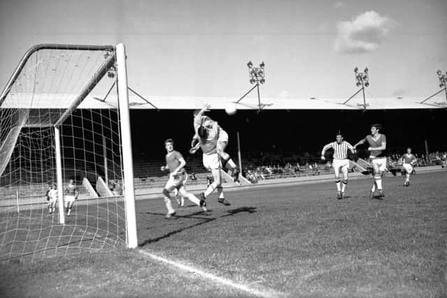 Third Lanark in action against Dunfermline at Cathkin Park in August 1964. The club went bust three years later and the ground was effectively abandoned before being bought by the local council. Picture: TSPL