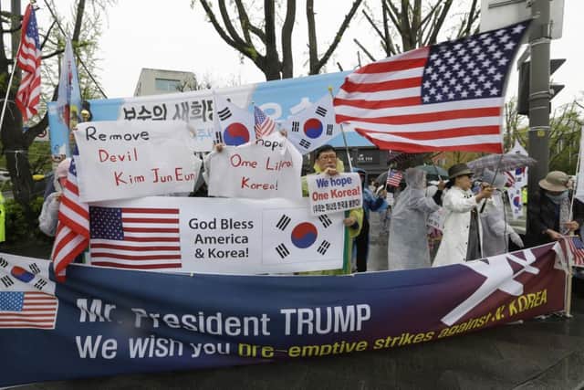South Koreans stage a rally with the U.S. and South Korean flags to welcome a visit of U.S. Vice President Mike Pence. Picture: AP