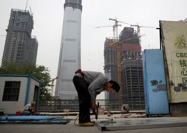 The world's second-largest economy is targeting growth of 6.5% this year. Picture: Andy Wong/AP