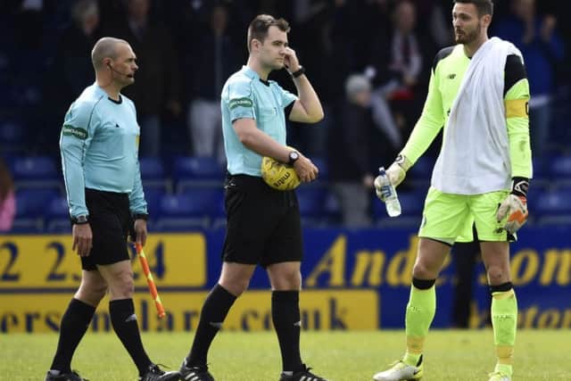 Craig Gordon, right, approaches referee Don Robertson at full-time. Picture: SNS