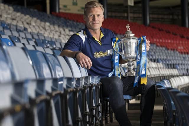 Former Celtic defender Johan Mjallby with the Scottish Cup  at Hampden Park.