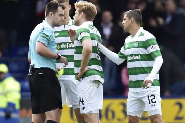Celtic stars complain to referee Don Robertson after Ross County draw. Picture: SNS