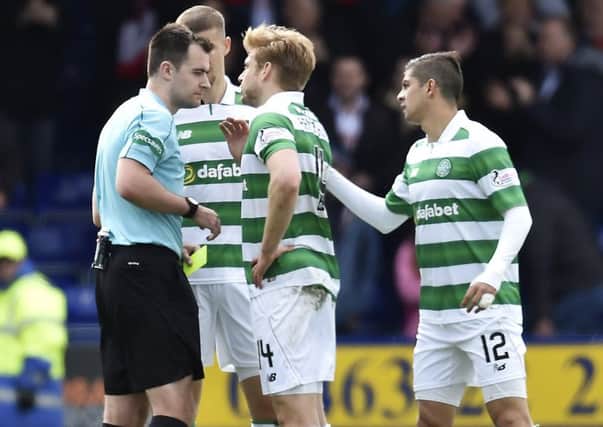 Celtic stars complain to referee Don Robertson after Ross County draw. Picture: SNS