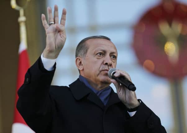Turkish president Recep Tayyip Erdogan delivers a speech during a rally the day after the referendum. Picture: AP Photo/Burhan Ozbilici