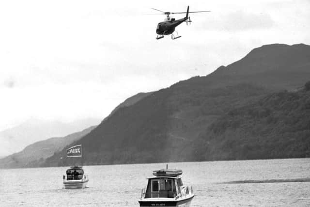 A helicopter helps coordinate some of the boats involved in 1987's 'Operation Deep Scan' in a bid to find Nessie. Picture: TSPL