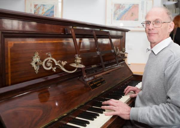 Piano tuner Martin Backhouse who made the discovery of gold coins. Picture: SWNS