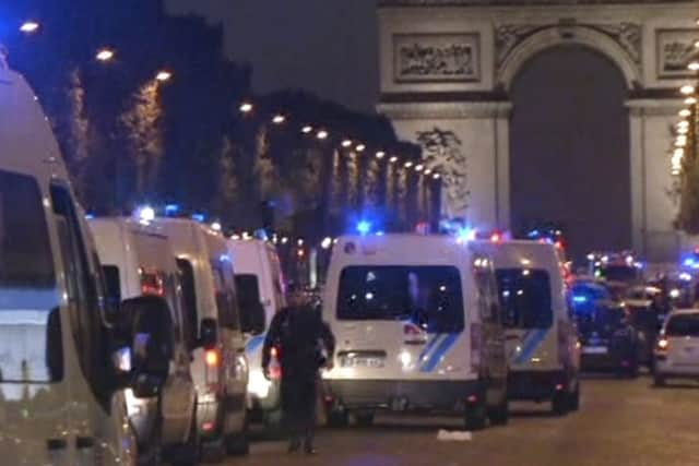 Police attend the scene after an incident on the Champs-Elysees in Paris. Picture: AP