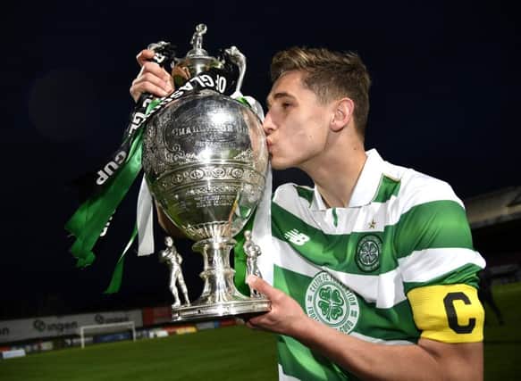 Celtic captain Robbie Deas kisses the trophy at full time. Picture: SNS