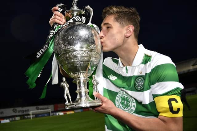 Celtic captain Robbie Deas kisses the trophy at full time. Picture: SNS