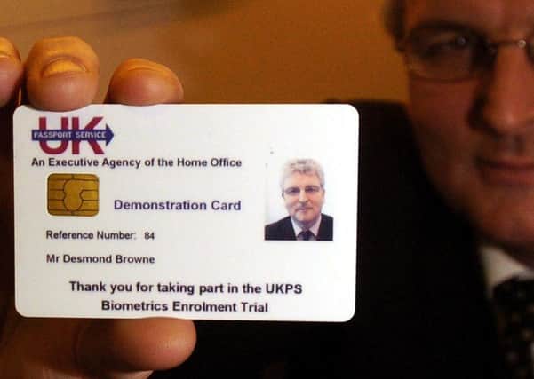 The former Home Office minister with the card that was scrapped