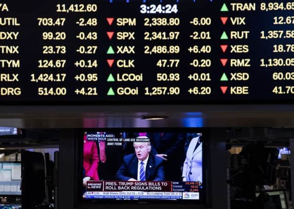 Trump appears on a New York Stock Exchange monitor. Picture: Drew Angerer/Getty
