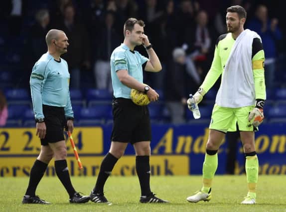 Referee Don Robertson (centre) erroneously awarded Ross County a penalty at the end of last weekend's clash with Celtic. Picture: SNS