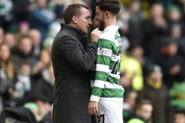 Brendan Rodgers congratulates playmaker Patrick Roberts, one of the players he has helped to improve.  Picture: Rob Casey/SNS