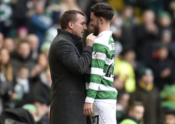 Brendan Rodgers congratulates playmaker Patrick Roberts, one of the players he has helped to improve.  Picture: Rob Casey/SNS