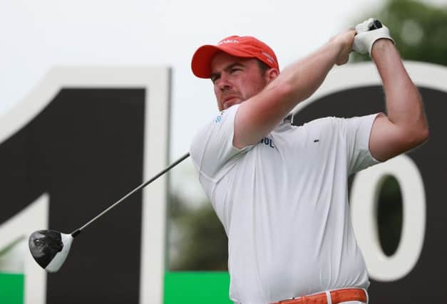 Richie Ramsay tees off on his way to a second-round 68 at Genzon Golf Club in China. Picture: Getty Images
