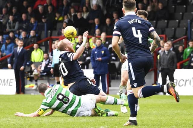 Celtic's Scott Brown was sent off for his challenge on Ross County's Liam Boyce. Picture: Rob Casey/SNS