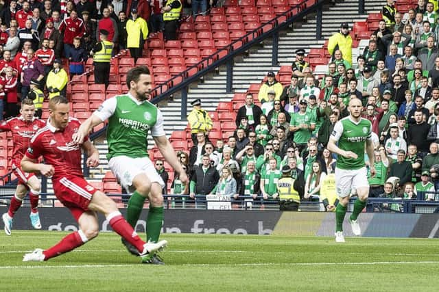 Aberdeen's Adam Rooney scores the opener after 11 seconds. Pic: SNS/Bill Murray