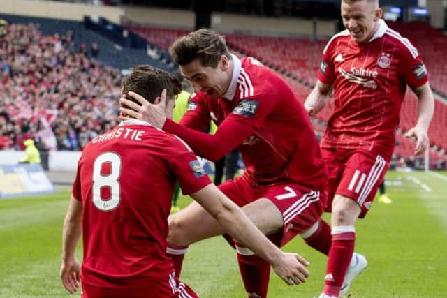 Ryan Christie celebrate Aberdeen's second goal with Kenny McLean and Jonny Hayes. Pic: SNS/Bill Murray