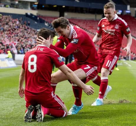 Ryan Christie celebrate Aberdeen's second goal with Kenny McLean and Jonny Hayes. Pic: SNS/Bill Murray