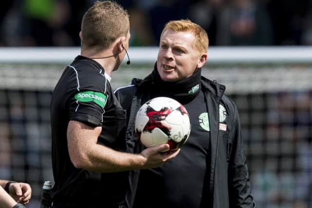 Neil Lennon remonstrates with referee John Beaton at half time