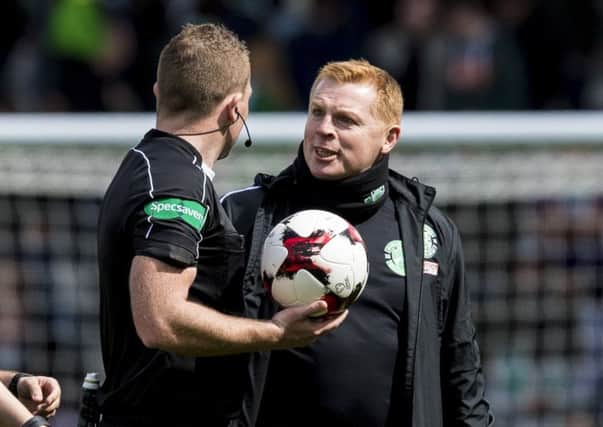 Neil Lennon remonstrates with referee John Beaton at half time