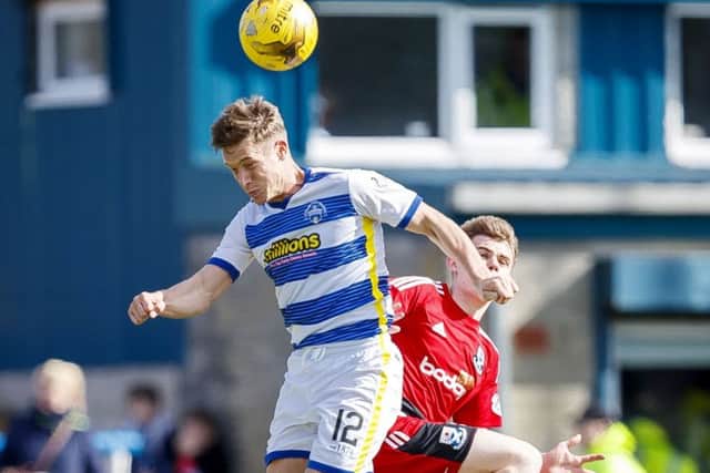 Mortons Michael Tidser gets the better of Alan Forrest.  Photograph: Roddy Scott/SNS