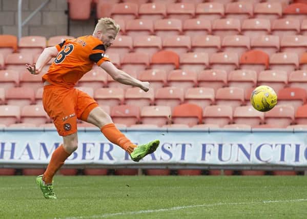 Thomas Mikkelsen scores the controversial opening goal. Picture: Alan Harvey/SNS