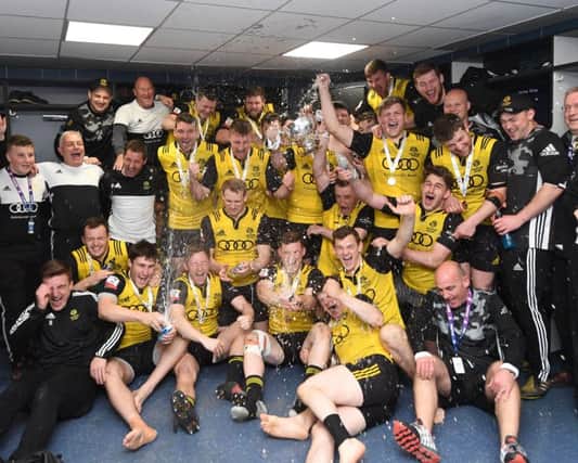 Melrose players and staff celebrate their cup win over Ayr at Murrayfield. Picture: Gary Hutchison/SNS