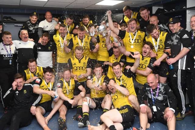 Melrose players and staff celebrate their cup win over Ayr at Murrayfield. Picture: Gary Hutchison/SNS