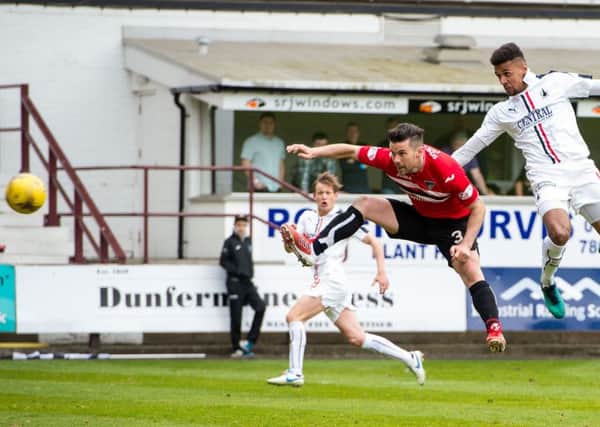 Nathan Austin, right, heads home Falkirks winner against Dunfermline. Photograph: Ross Parker/SNS